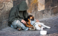 beggar with two Dogs near Charles Bridge, Prague